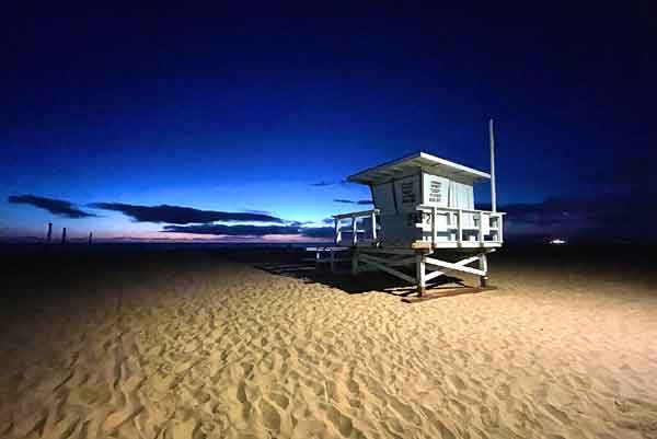 Hermosa Beach lifeguard tower evening sunset background